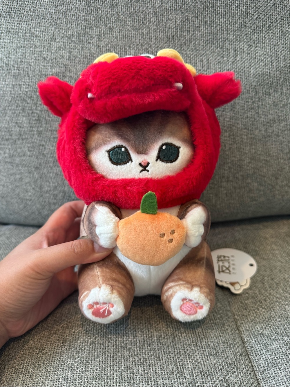 Plush Kitten Wearing Red Dragon Hood with Orange Plush